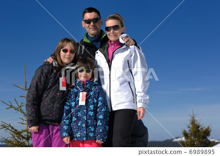 portrait of happy young family at winter portrait of happy young family at winter 6989895