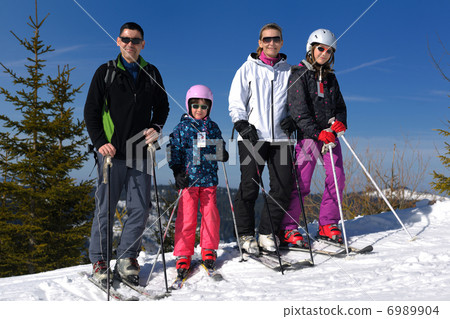 portrait of happy young family at winter portrait of happy young family at winter 6989904