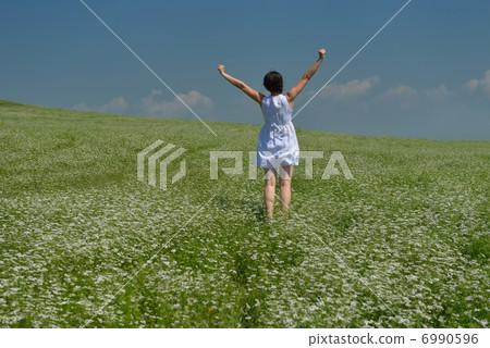 Young happy woman in green field Young happy woman in green field 6990596
