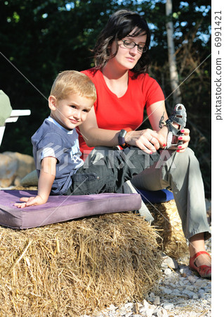 woman and child have fun outdoor 6991421