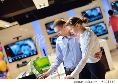 people buy in consumer electronics store 6991538