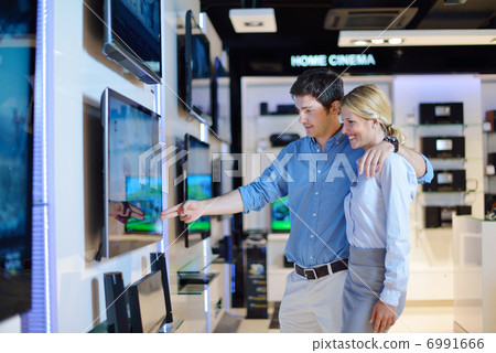 people buy in consumer electronics store 6991666