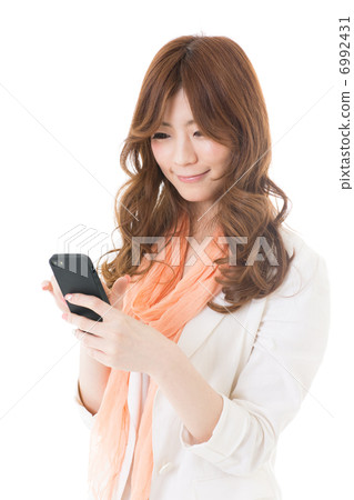 Woman using a smartphone 6992431