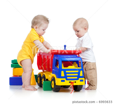 two little children playing with color toys two little children playing with color toys 6993633