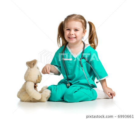 Adorable girl with clothes of doctor playing with toy over white 6993661
