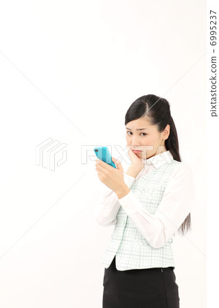 A woman watching a smartphone (worried) A woman watching a smartphone (worried) 6995237