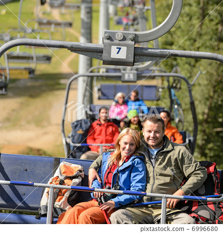 Couple hugging on romantic chairlift trip Couple hugging on romantic chairlift trip 6996680