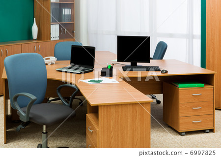computer and laptop on a desk computer and laptop on a desk 6997825