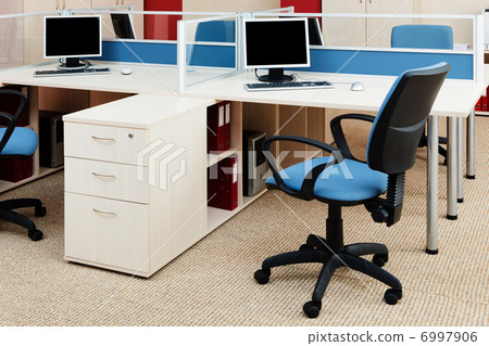 computers on a desk 6997906