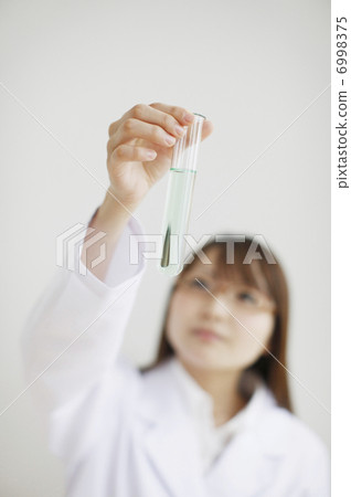 A woman with a test tube 6998375
