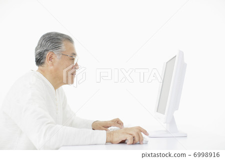 Japanese senior male doing personal computer Japanese senior male doing personal computer 6998916