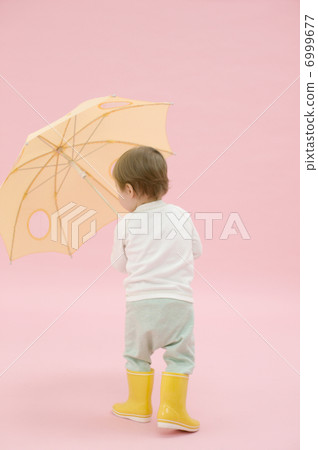 A boy with an umbrella A boy with an umbrella 6999677