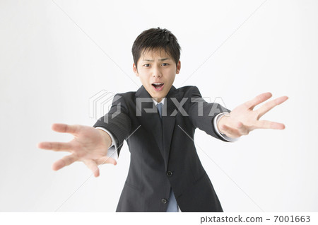 A businessman putting both hands forward 7001663