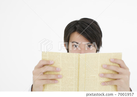 A young man who opens a book 7001957