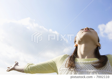 A woman under the blue sky A woman under the blue sky 7002110