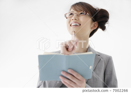 Business woman with a notebook Business woman with a notebook 7002266