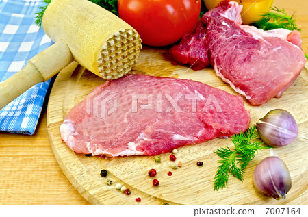 Meat batted with a hammer and vegetables Meat batted with a hammer and vegetables 7007164