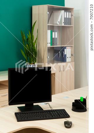 computer on a desk 7007210