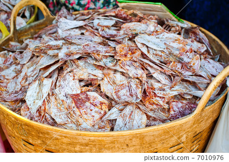 Sea food at market. Selling dry calamari in Thailand 7010976