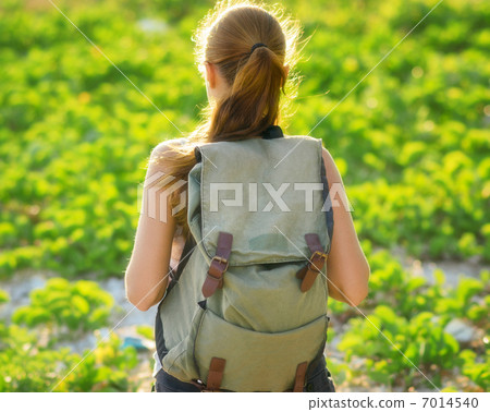 Young woman hiking with backpack 7014540