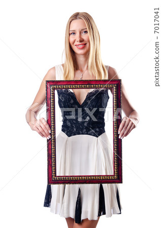 Young woman with picture frame on white 7017041