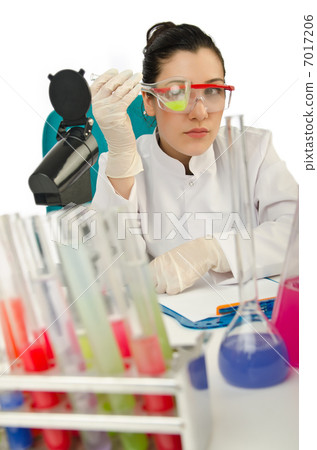 Female chemist in studio on white 7017206