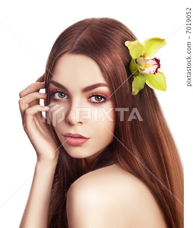 Pampering. Serene Woman with Orchid Fresh Flower in Hair. Tenderness 7019052