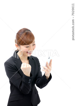 Business woman doing a fist pump Business woman doing a fist pump 7020011