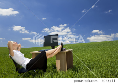 Woman Relaxing In a Green Office 7023411
