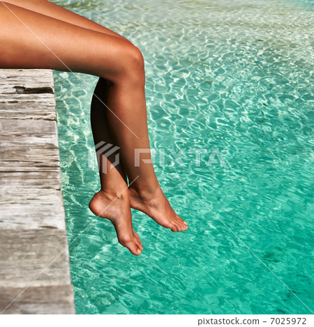 Woman at beach jetty 7025972