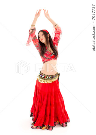 A young lady who makes a belly dance cockpit with sexy red crimson A young lady who makes a belly dance cockpit with sexy red crimson 7027727