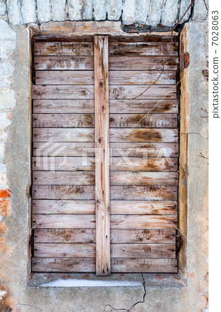 old house with boarded up window old house with boarded up window 7028063