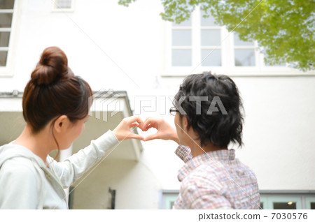 A couple making a heart mark 7030576