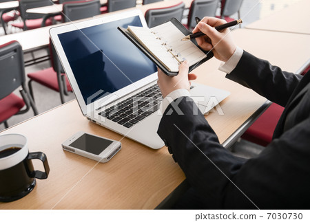 Writing in a notebook OL 7030730