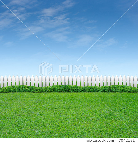White fence and green grass 7042151