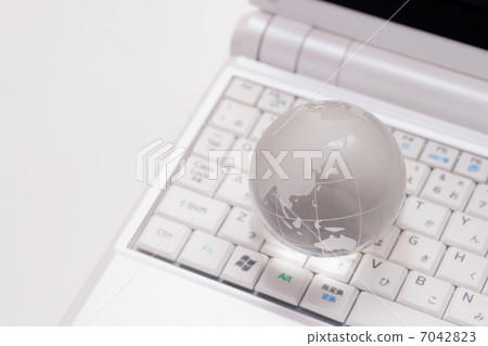 Laptop PC and glass globe 7042823