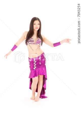 A young lady dancing belly dance with sexy outfits that have opened up to the knees 7043254