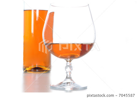 bootle and glass of brandy 7045587