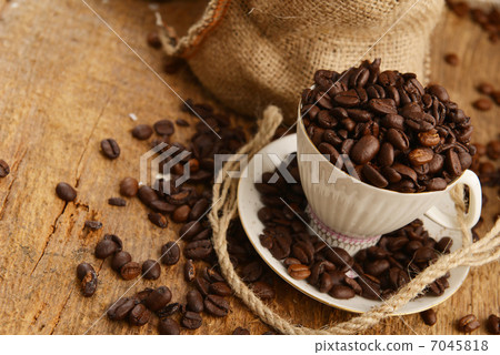 Coffee beans and cup Coffee beans and cup 7045818
