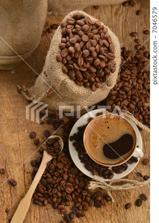 Coffee beans and cupCoffee beans and cup 7046579