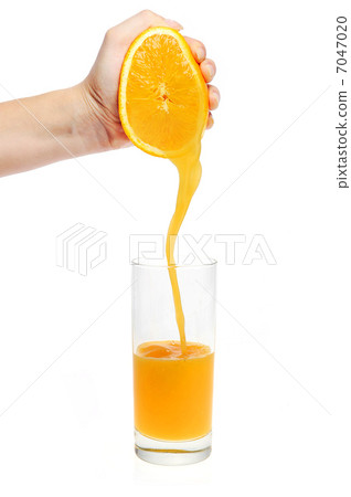 woman hand pour orange juice woman hand pour orange juice 7047020