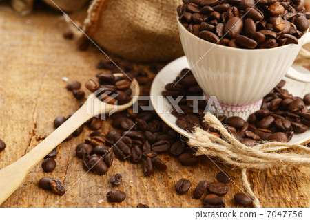 Coffee beans and cup Coffee beans and cup 7047756