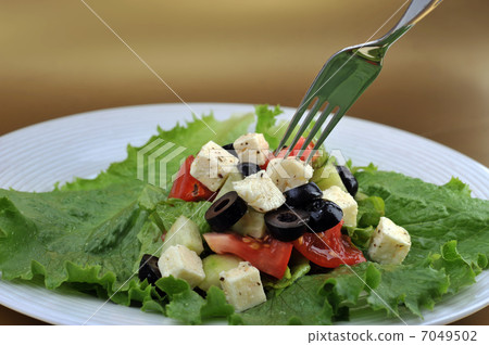 salat with feta cheese and fresh vegetables 7049502