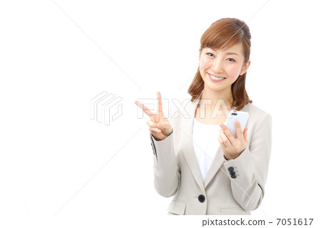 Business woman to piece with a smartphone Business woman to piece with a smartphone 7051617