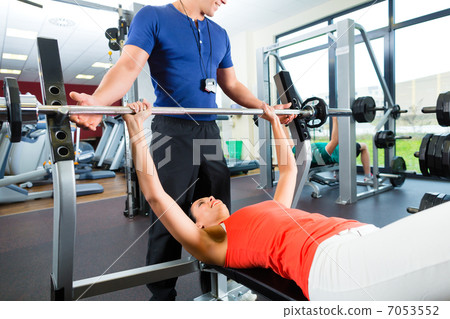 woman and Personal Trainer in gym woman and Personal Trainer in gym 7053552