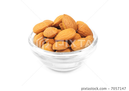 Dried almonds on glass bowl isolated on a white background 7057147