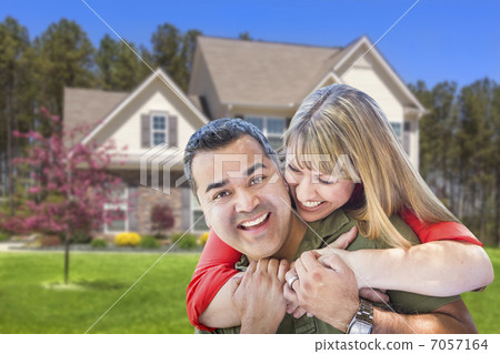 Mixed Race Couple Hugging in Front of House Mixed Race Couple Hugging in Front of House 7057164