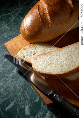 white loaf and knife white loaf and knife 7065009