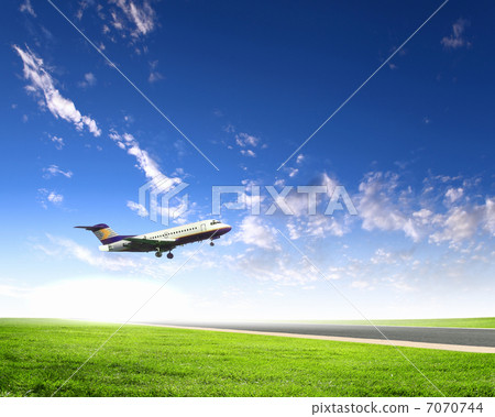 Airplane in blue cloudy sky Airplane in blue cloudy sky 7070744