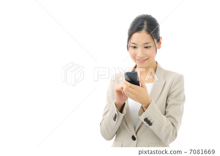 Business woman watching smartphone 7081669